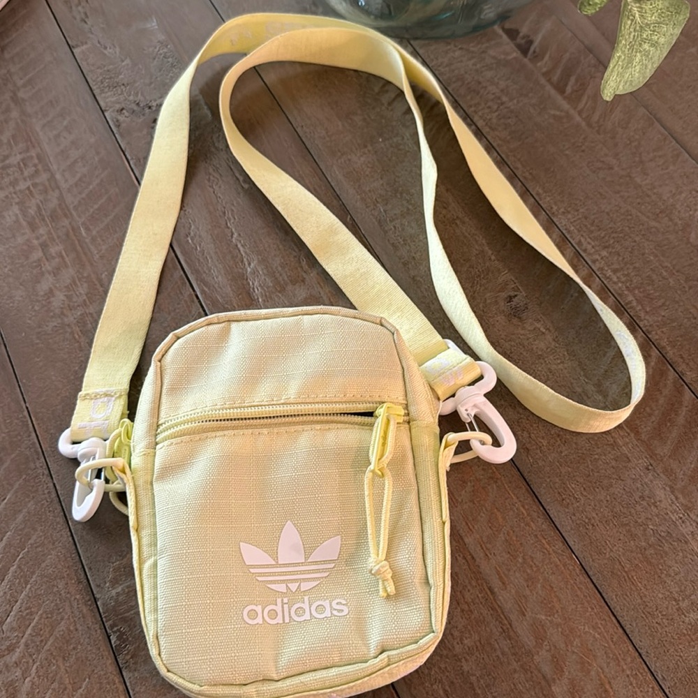 NWOT, Adidas crossbody phone/ utility pouch in neon yellow .